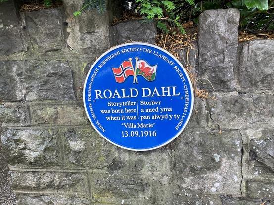 A circular blue wall plaque. The plaque marks the birthplace of Roald Dahl