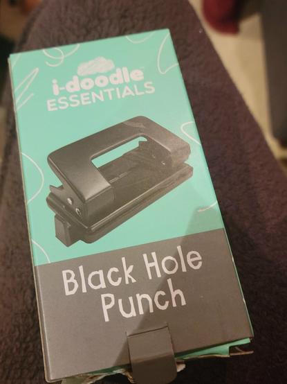 A hole puncher in a box that says "Black Hole Punch"