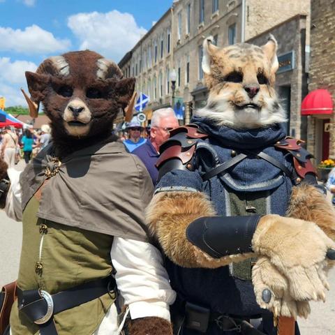 Brown long horned ram costume and Khajiit costume at Fergus Medieval
Faire.
