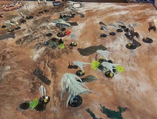 A game of Dropfleet Commander underway, Scourge vs PHR.