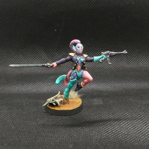 A painted harlequin from Warhammer 40k