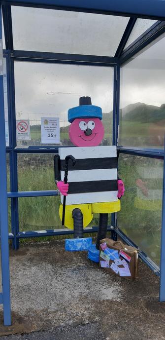 A sculpture of Bertie Bassett in a bus shelter on the island of Seil. This is one of dozens of entries in the annual Scarecrow Festival.