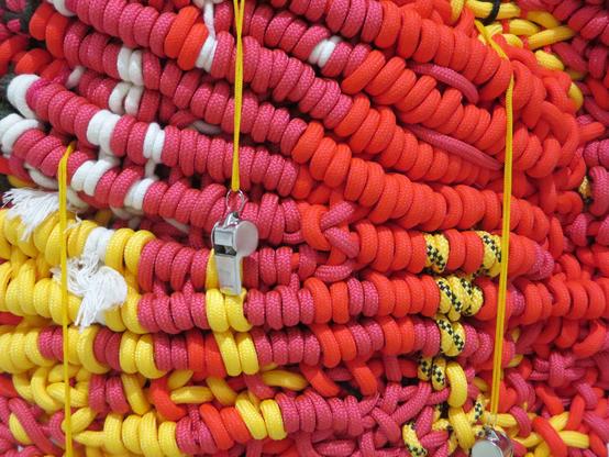 Alyona Repkina, “Hive”, 2023, textiles, steel whistles, 100 × 140 × 8 cm // Abstract knitted lace sculpture, detail. In this photo you can see how the sculpture is assembled and see one of the whistles up close. // Алёна Репкина, «Улей», 2023, шнурки, верёвки и стальные свистки, 100 × 140 × 8 см // Абстрактная вязаная скульптура из шнурков, деталь. На этой фотографии можно посмотреть, как связана скульптура и увидеть вблизи один из свистков.