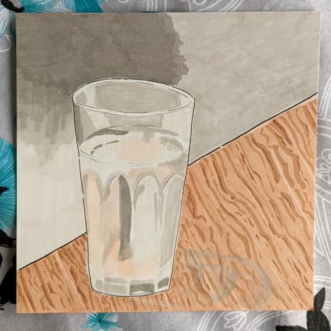 Pen and marker sketch of a glass of water on a wooden table.
