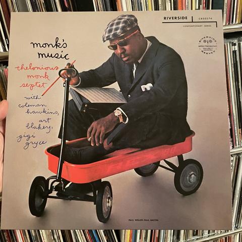 Monk's Music record cover, with a cool photo of Monk wearing shades seated inside a little cart.