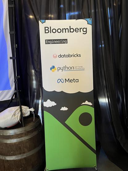 The sponsorship billboard, listing Bloomberg Engineering, Databricks, Python Software Foundation, and Meta.