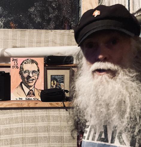 Don Bolles poses in front of a painting of his namesake the reporter Don Bolles who was blown to bits in 1976