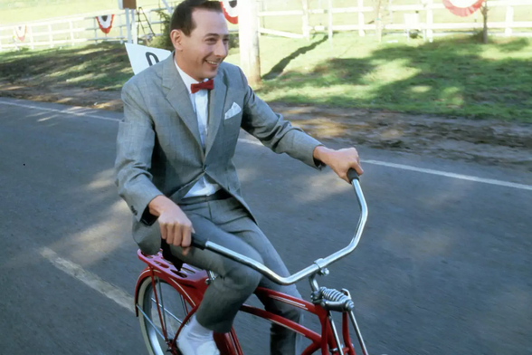 Paul Reubens riding a bike in "Pee-wee's Big Adventure"