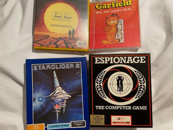 Amiga-Spiele: Trivial Pursuit, Garfield, Starglider 2, Espionage. Alles Disketten, inkl. Originalverpackung.
