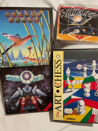 Mehr Amiga-Spiele: Chrono Quest, SpinWorld, Art Chess, Whirligig (wenn ich das richtig lese). Alles Disketten inkl. Originalverpackung.