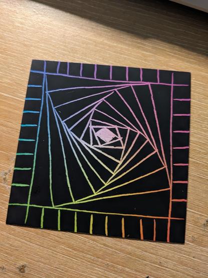 Etch art doodle, a rainbow colored square-ish spiral.