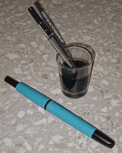 Soaking fountain pen nib.