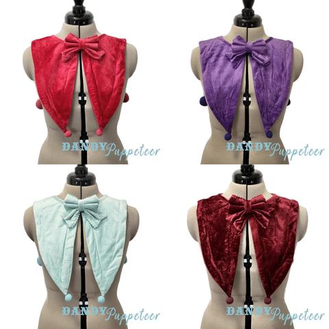 A collage of 4 mannequins wearing Jester inspired fashion collars. The collars are velvet and have two pointy front tails and a bow at the neck. From top left to right right: Red, Purple, Mint, Wine