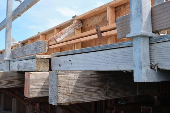 A set of wooden planks underneath a blue sky.