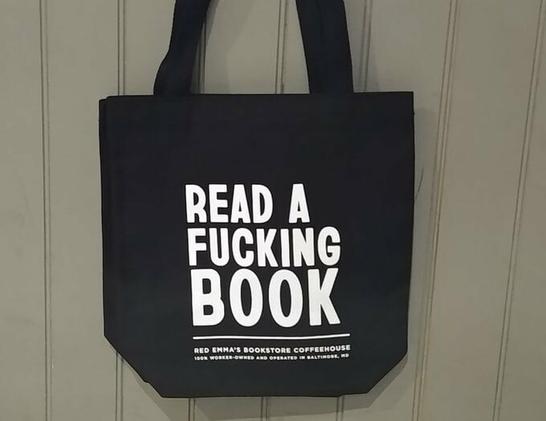 image of a black shopping bag from Red Emma's bookstore and coffee house in Baltimore, MD
text:
white in all caps "Read a fucking book"