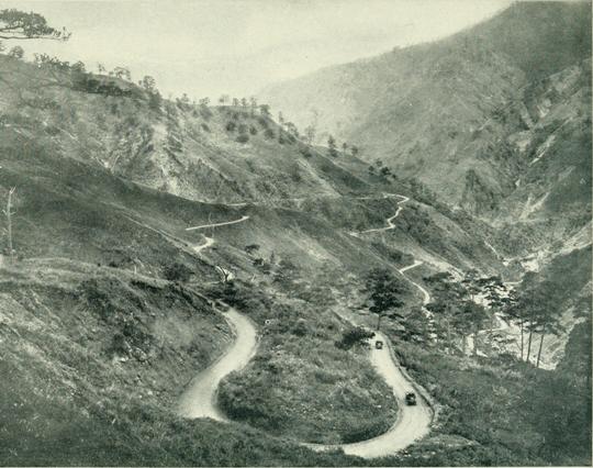 photo of a road built along the mountains