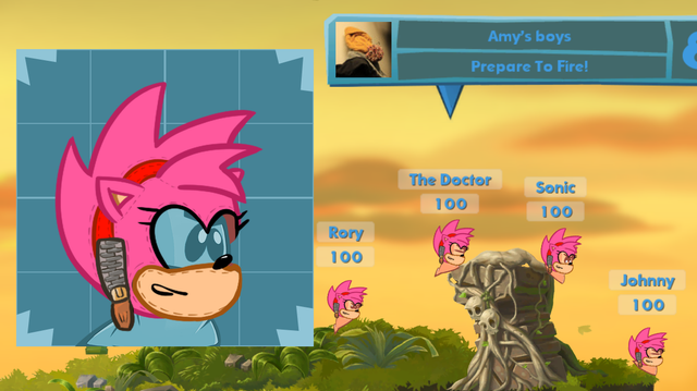 Four worms on a Worms WMD landscape, called The Doctor, Rory, Sonic, and Johnny. The team name is "Amy's boys". They are all wearing an Amy head as a balaclava-like "hat". On the left is the full size version of the "hat", which shows a zip detail on the side and stitching on the seams.