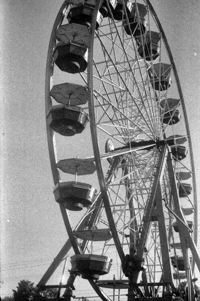 Black and white photograph of a ferris wheel