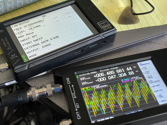 Photo showing TinySA Ultra in signal generator mode and NanoVNA running the TinyPFA firmware.
