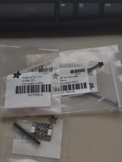 2 Adafruit 5v to 3v Shifter QT boards, and a couple of qwiic cables. New in retail packing.