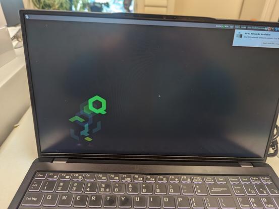 A laptop screen with the OS booted, showing that it's working again.