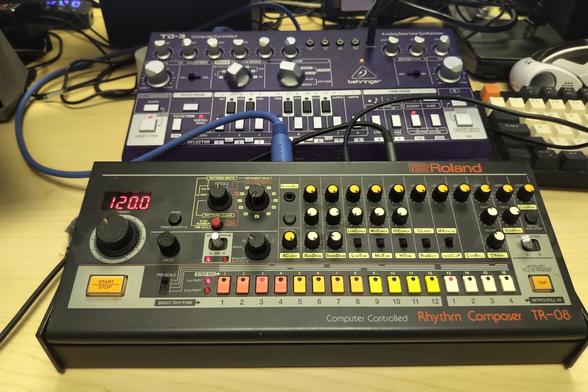 A purple behringer TD3 and a Roland TR-08 locked to the beat (120)