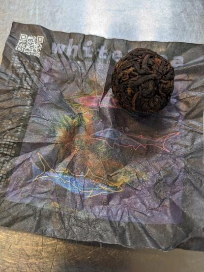 Shou puerh dragon ball and colorful wrapper.