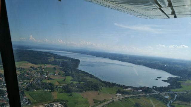 Ammersee below right wing.