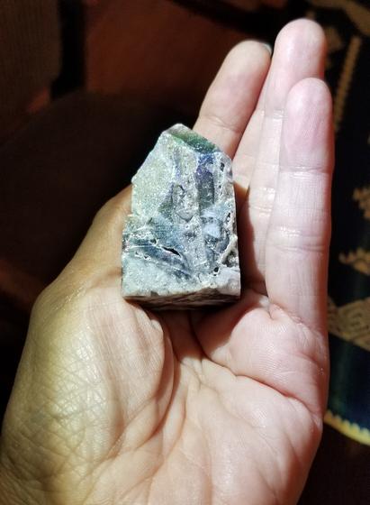 Gorgeous lepidolite specimen in my left hand. You can see mica metals.