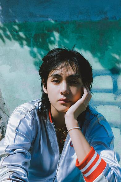 Taehyung photo from Weverse set 1. Baseball jacket & long is it a mullet hairstyle.