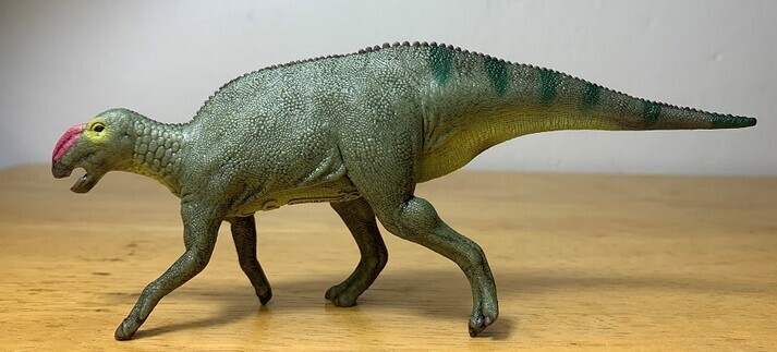 Hadrosaurus figurine in profile view.