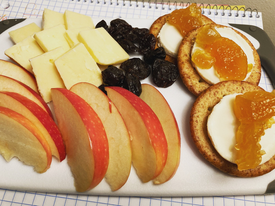 Cheeses, apples, and dried fruit