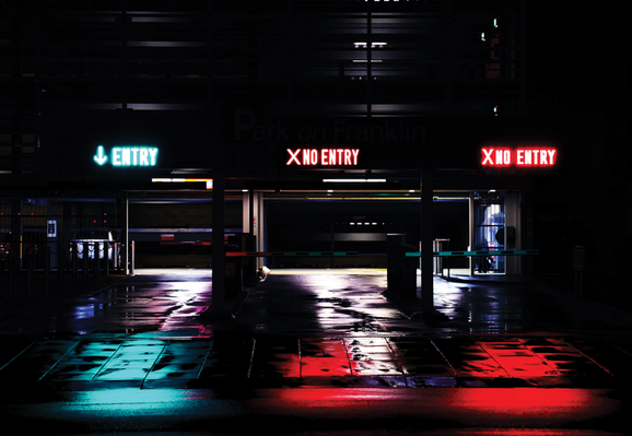 image of a parking garage with signs showing Entry and No Entry with blue and red lighting
