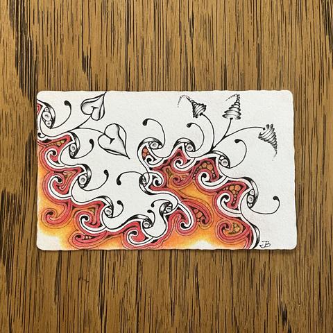 Zentangle art created on a white Phi tile. I used a Micron 01 black pen and added colour using General’s pastel chalk in reds and yellows. The design is very abstract with part in colour and part in black lines only