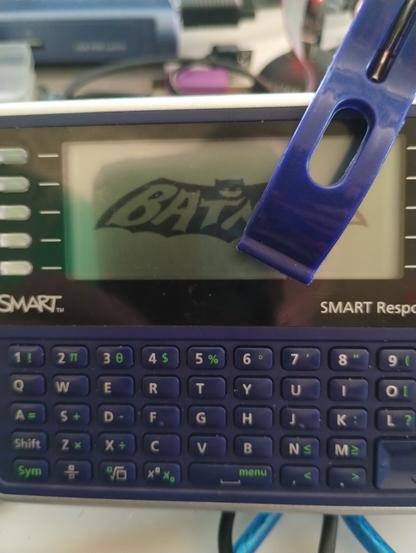 Batman logo on a Smart Response XE device.  You can see a clip holding my programmer in place