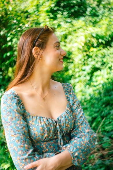 Photo of young smiling woman with Domiplan bokeh in background