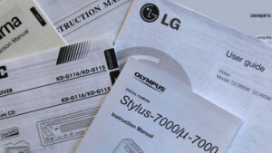 A selection of printed paper manuals for small electronics.