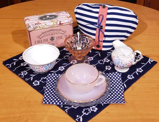 A tea tableau in jaunty pink and navy polka dots and stripes, with an English black tea.
