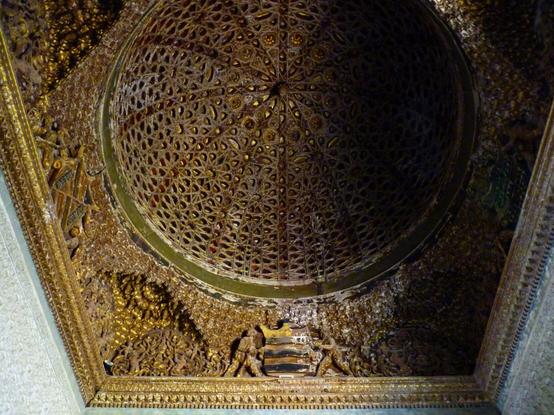 Cedarwood dome, of Islamic construction, with intricate carving and painting, and gold leaf detailing.