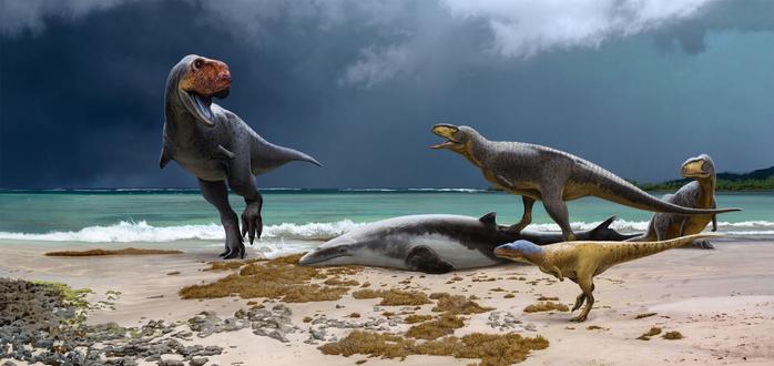 life reconstruction of a group of carnivorous dinosaurs scavenging a beached marine reptile next to sea