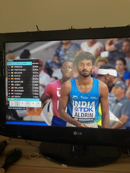 A photo of my telly, showing a competitor at the Athletics World Championships, in the Long Jump event. In the week when India successfully landed a spacecraft on the moon, he represents India and his surname name is Aldrin. Amazing.