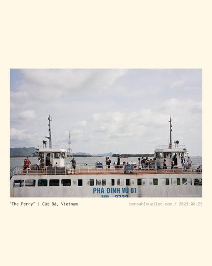 A few tourists standing on the upper deck of an old ferry. They seem at easy, doing tourist things, probably looking forward to their vacation.