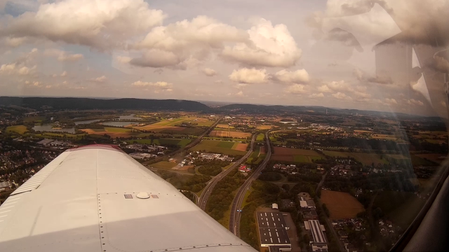 Overwing view out of a PA28, aerial view of the Wiehen hills with the Porta and EDVY