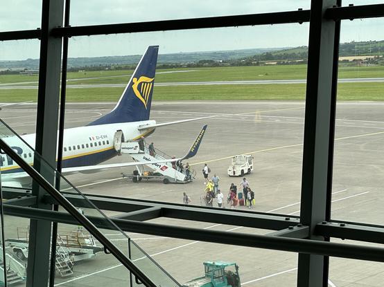People leaving a Ryanair flight they were due to depart on.