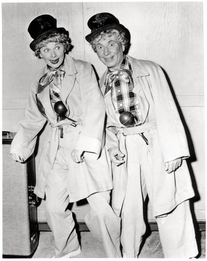 Lucille Ball and Harpo Marx dressed identically.