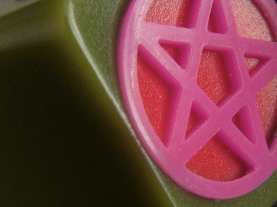 a really, really, really (macro) closeup photo of an artisan keycap by GothCaps
