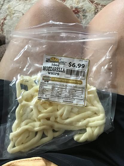 Package of mozzarella cheese whips. They are long, skinny pieces of cheese.