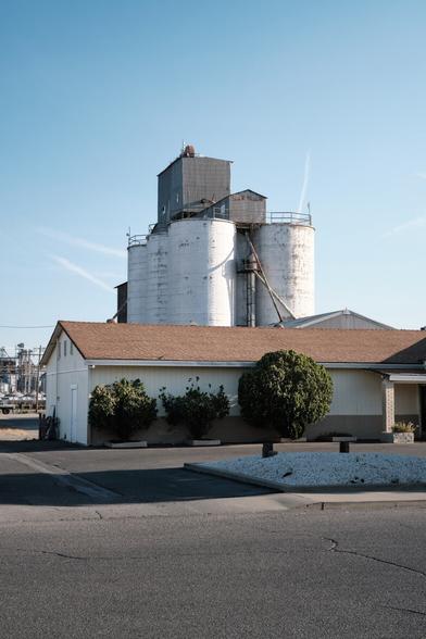 A large grain silo (?) in morning light.