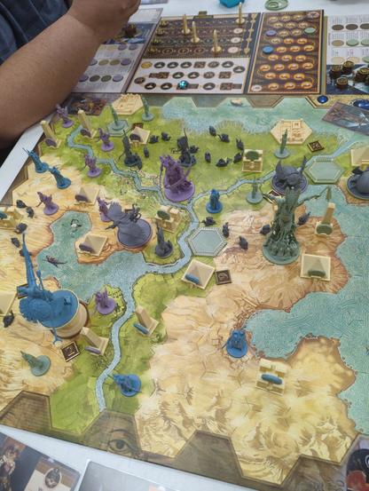 A photo of an area control game set in Egypt, filled with Gods and their legions.