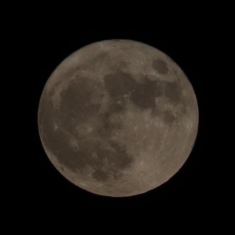 a full moon against a black background